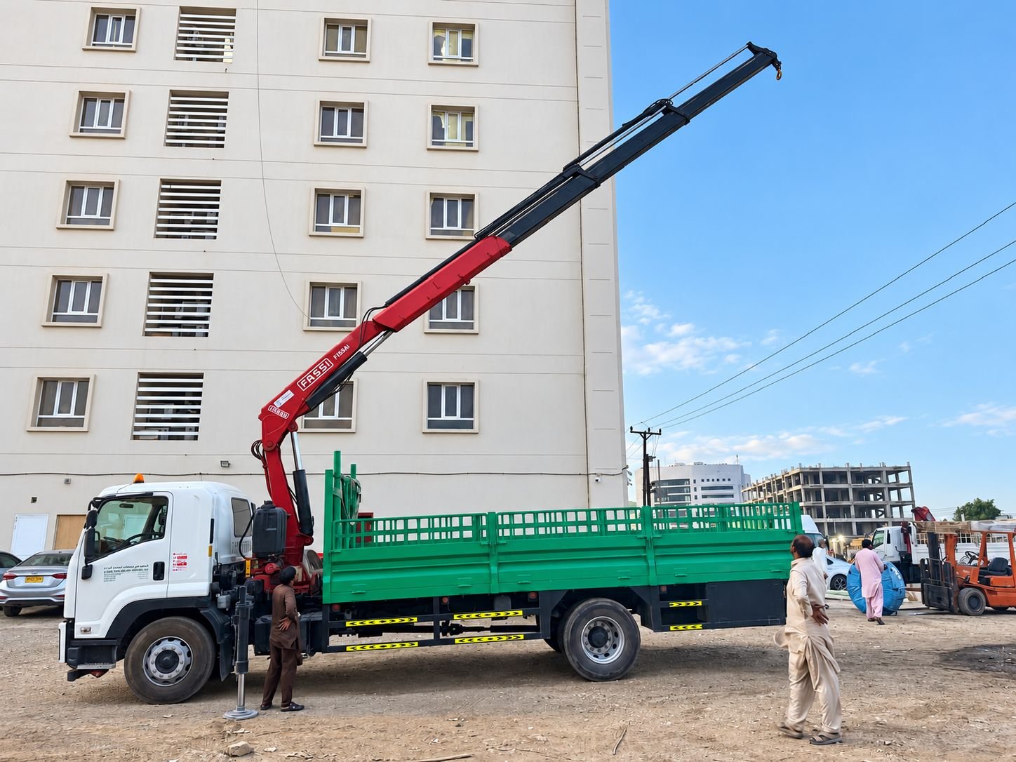 Fassi crane truck lifting at a Muscat site