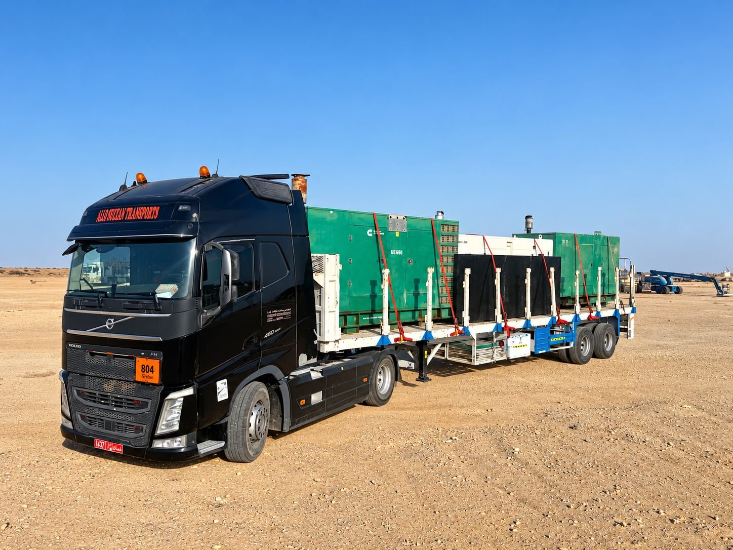 Volvo FH tractor head with flatbed trailer carrying generators in Oman